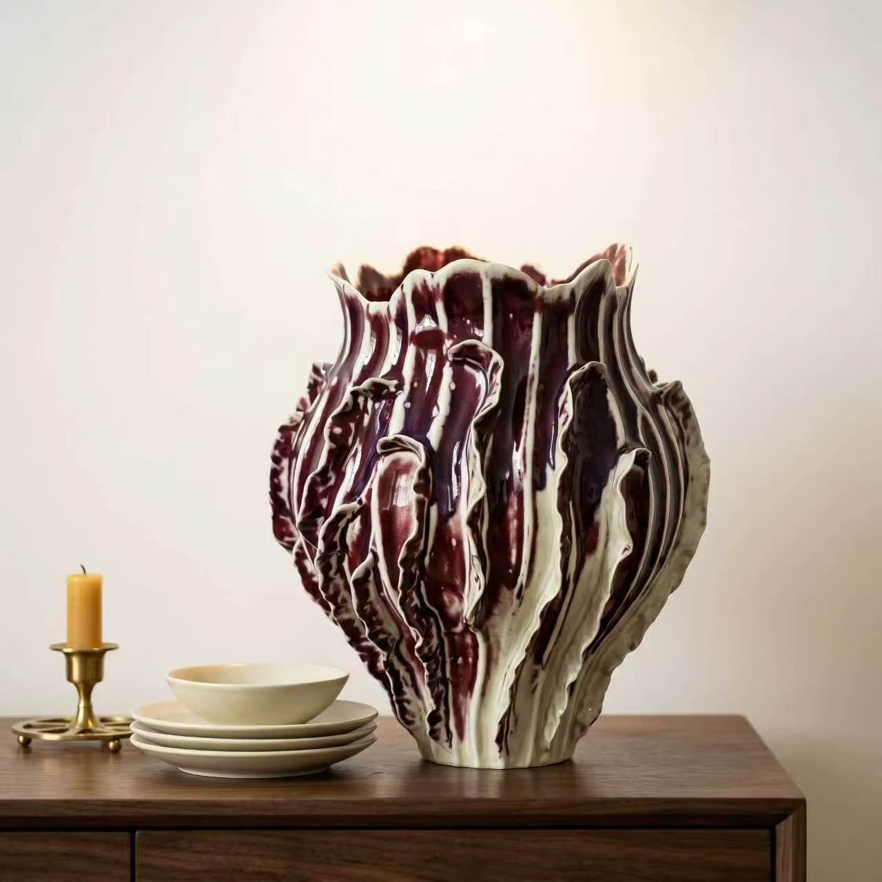 Burgundy sculptural ceramic vase in the Tongxin ceramic collection